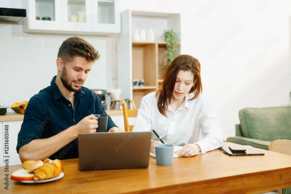 Modern couple collaborating over coffee in a cozy kitchen setting with a laptop, notebook, and breakfast. Modern couple collaborating over coffee in a cozy kitchen setting with a laptop, notebook, and breakfast.