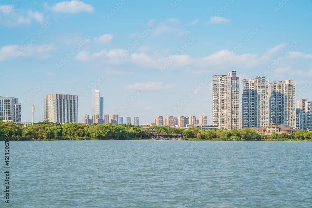 The skyline of modern urban buildings and the scenery of the Taihu Lake Lake in Wuxi, Jiangsu Province, China will be built on April 1, 2024 The skyline of modern urban buildings and the scenery of the Taihu Lake Lake in Wuxi, Jiangsu Province, China will be built on April 1, 2024