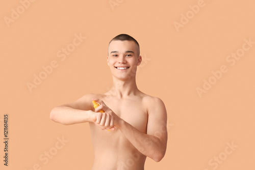 Happy young man applying su...