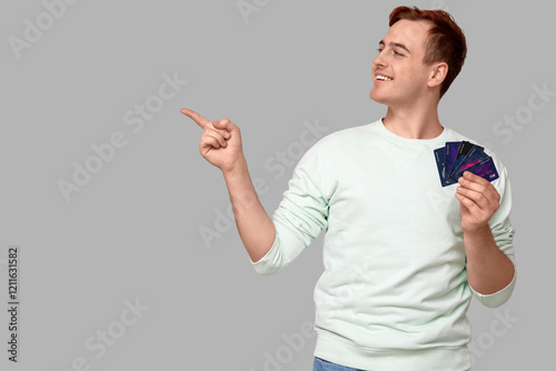 Young man with credit cards...