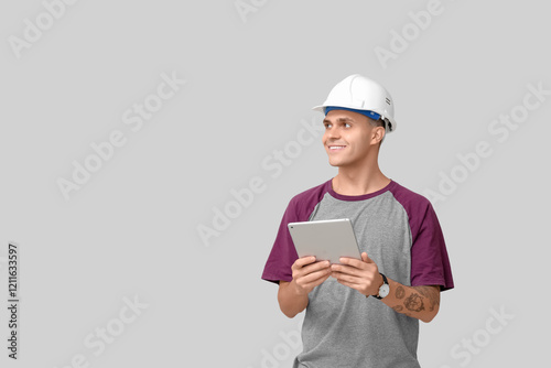 Young male engineer with ta...