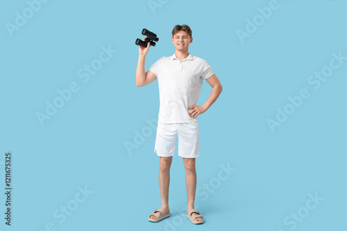 Male lifeguard with binocul...