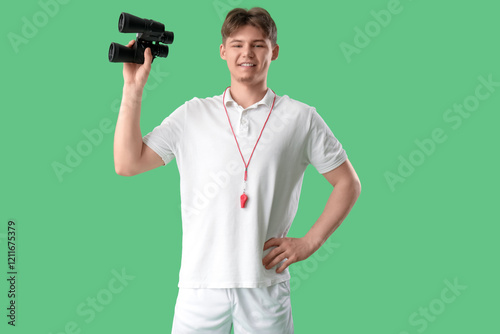 Male lifeguard with binocul...