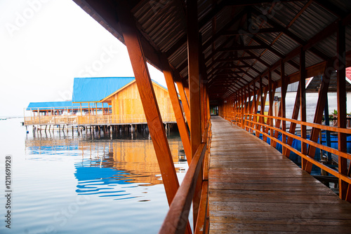 architecture of bridges and wooden corridors connecting houses in Bajo tribal settlements on the water photo