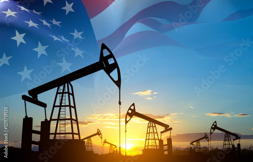 Silhouette of oil rigs against the sunset with USA flag. USA oil industry concept