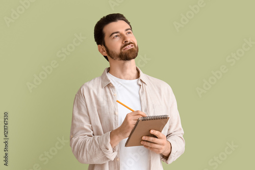 Handsome man with notebook ...