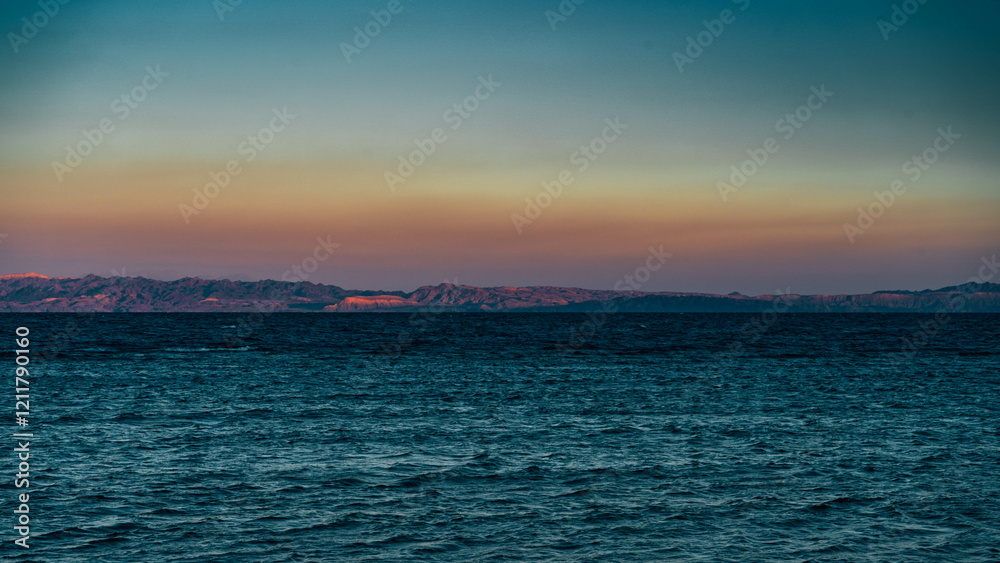 sunset over the beach and mountains sunset over the beach and mountains