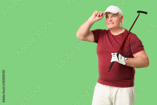 Sporty senior man with golf...