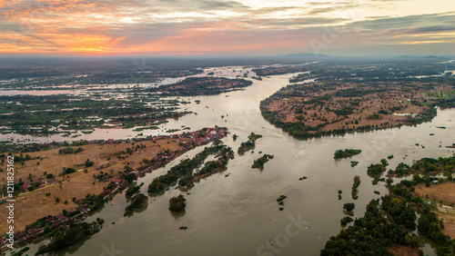 Aerial sunset landscape in Mekong River, Laos 4000 Islands, reflection in traditional tropical Village
