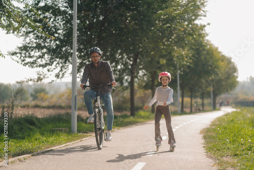 Wallpaper Mural Father and daughter enjoying a sunny day cycling and roller skating in the park Torontodigital.ca