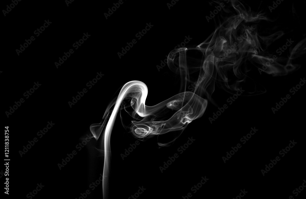 Mysterious smoke billows out, separated from the background, creating an abstract mystical atmosphere as particles of vapor and incense float into the air. Dark grey smoke mixes with mistvapor Mysterious smoke billows out, separated from the background, creating an abstract mystical atmosphere as particles of vapor and incense float into the air. Dark grey smoke mixes with mistvapor