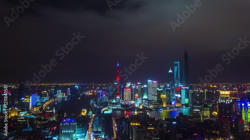 Wallpaper Mural SHANGHAI, CHINA - JANUARY 12, 2025: City skyline illuminated at night showcasing vibrant lights along the river and iconic buildings Torontodigital.ca