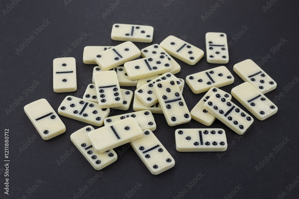 Big heap from dominoes on a dark background Big heap from dominoes on a dark background