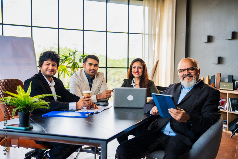 Indian asian Business professionals discussing ideas during a formal meeting in a conference room Indian asian Business professionals discussing ideas during a formal meeting in a conference room