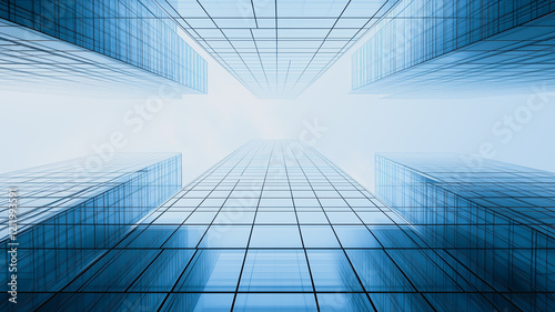 Urban Canyon: A low-angle perspective looking upward reveals a dramatic urban canyon, where towering skyscrapers create a maze of glass and steel, reaching towards a bright, hazy sky. photo