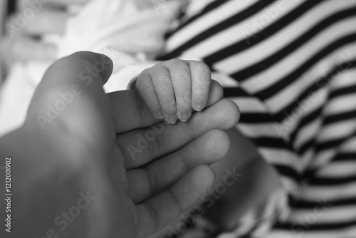 Newborn's Gentle Grasp photo