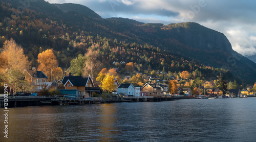 Scenic Fjordside Hamlet with Autumn Foliage and Tranquil Waters photo