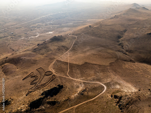 Obraz na płótnie Aerial view of the hills and road in the Sculpture Park Space and Time with the Rhythms of Life sculpture in Cappadocia w salonie