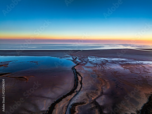 Drone View of a Riverbed in Black Sands on the Shore of Lake Tuz in the Golden Sunrise – Surreal Landscape photo