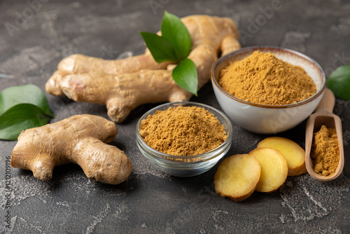 Fototapeta Naklejka Na Ścianę i Meble -  Fresh ginger on wooden background. Dry ginger. Sliced ​​ginger with honey and lemon. Ginger root. Traditional alternative medicine, healing tea for immunity. Seasoning and spices concept. Copy space.