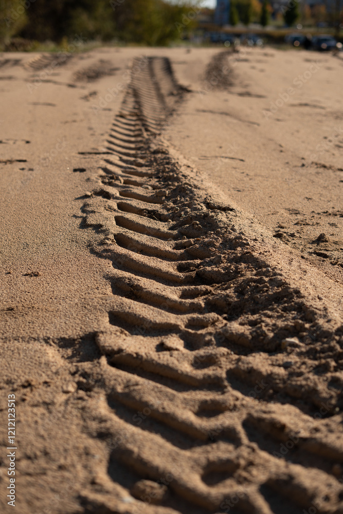 photo Close-up view of tire tracks imprinted on a sandy trail, showcasing intricate patterns and textures in the dry sand, highlighting off-road exploration possibilities photo Close-up view of tire tracks imprinted on a sandy trail, showcasing intricate patterns and textures in the dry sand, highlighting off-road exploration possibilities