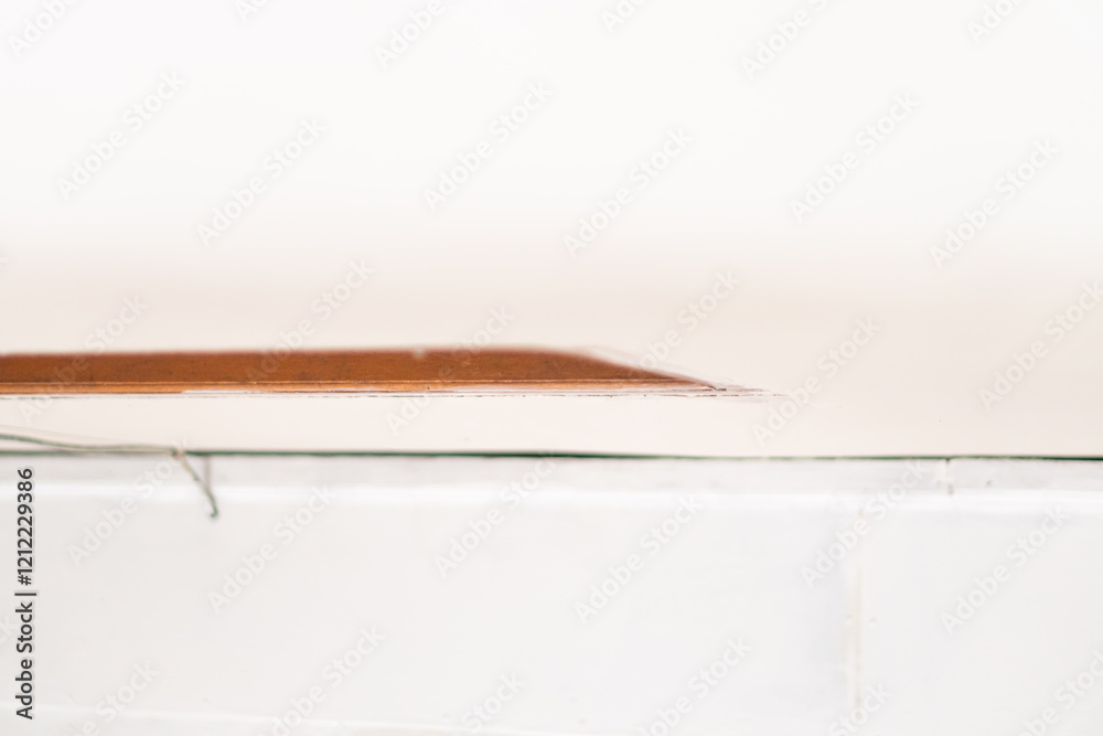 Fototapeta premium Close-up of Wooden Edge on White Surface