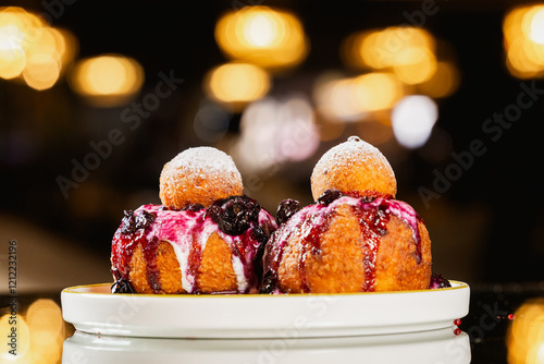 Papanasi, Romanian language name of a traditional cake in Romania made of dough with cheese, sour cream and different kind of jams like blueberry. Romanian traditional dessert. photo