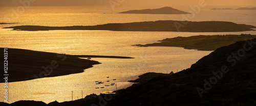 Sunset view of Ardmore and Turbot islands from famous scenic Sky Road, 15km looped drive starting in Clifden with numerous brilliant viewing points, Wild Atlantic Way, Connemara, Ireland. photo