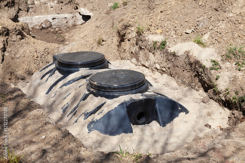 Closeup on 4000 litre plastic septic tank in a bed of sand during installation of a new domestic sanitation system photo