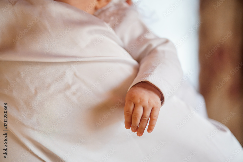 Close-up of an Infant's Hand Wrapped in Soft Fabric Close-up of an Infant's Hand Wrapped in Soft Fabric