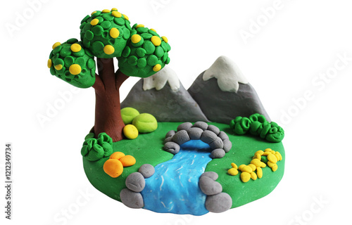 Vibrant Clay Miniature Landscape with Tree, Mountain, and River on White Background photo