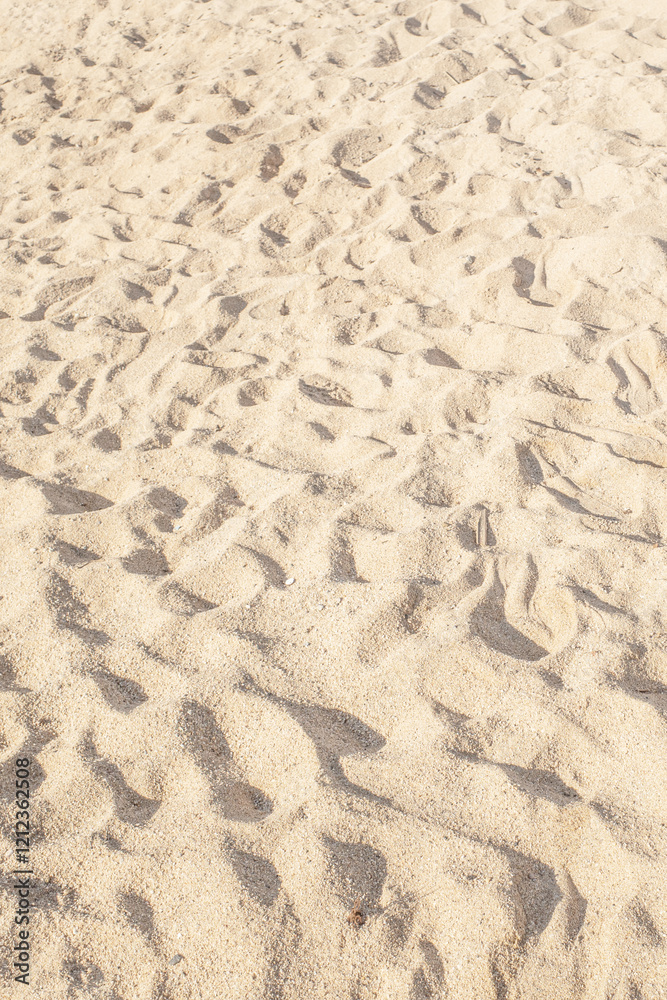 Summer beach sand background with natural wave pattern. Sand texture. Sunny gold sandy beach. Summer beach sand background with natural wave pattern. Sand texture. Sunny gold sandy beach.