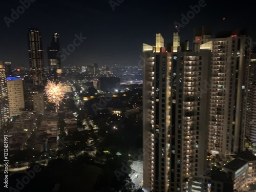 New Year's Eve celebration in Kemayoran Jakarta with beautiful lights from high-rise buildings and fireworks at night photo