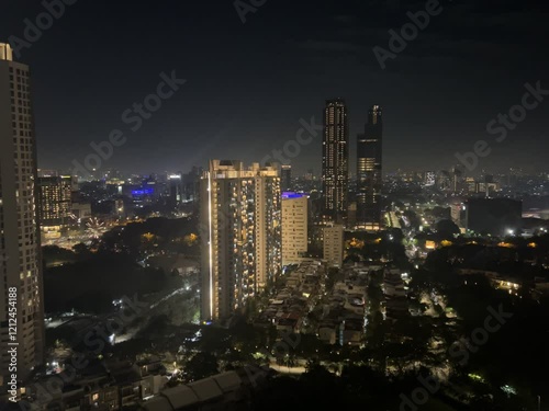 New Year's Eve celebration in Kemayoran Jakarta with beautiful lights from high-rise buildings and fireworks at night photo