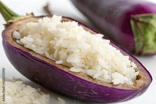 Close-up of fragrant and fluffy rice filling inside a tender purple eggplant, spices, culinary presentation, eggplant, stuffed vegetable, garnish photo