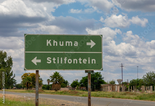 Close up on road sign reading Khuma and Stilfontein in left and right directions. Stilfontein is a small mining town in the North West province of South Africa.