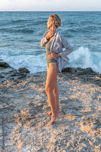 Beautiful young woman in swimsuit on the beach. Fashion concept.
