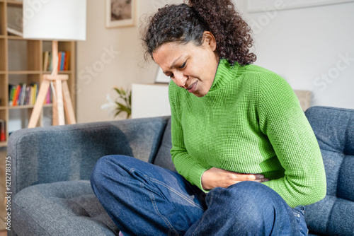 Black woman suffering heartburn and stomach pain