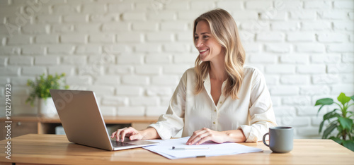 businesswoman with laptop in loft living room photo