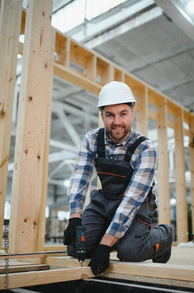 Portrait of a carpenter smiling with crossed arms in a lumber warehouse, showcasing expertise in the modular building industry Portrait of a carpenter smiling with crossed arms in a lumber warehouse, showcasing expertise in the modular building industry