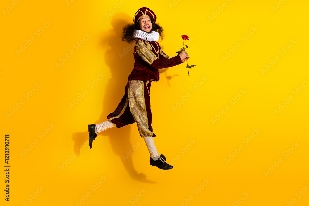 Young nobleman in medieval costume holding rose on vibrant yellow background, epitomizing classic era and modern Young nobleman in medieval costume holding rose on vibrant yellow background, epitomizing classic era and modern