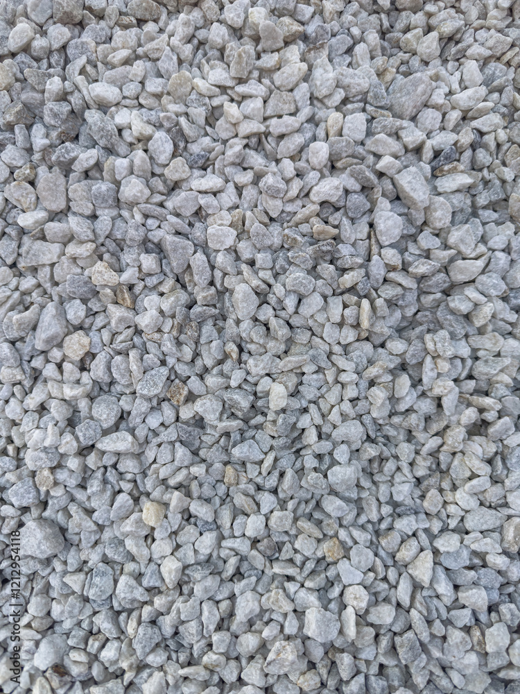 Background of natural gray small pebbles or stone in a garden paths and flower beds. Background of natural gray small pebbles or stone in a garden paths and flower beds.
