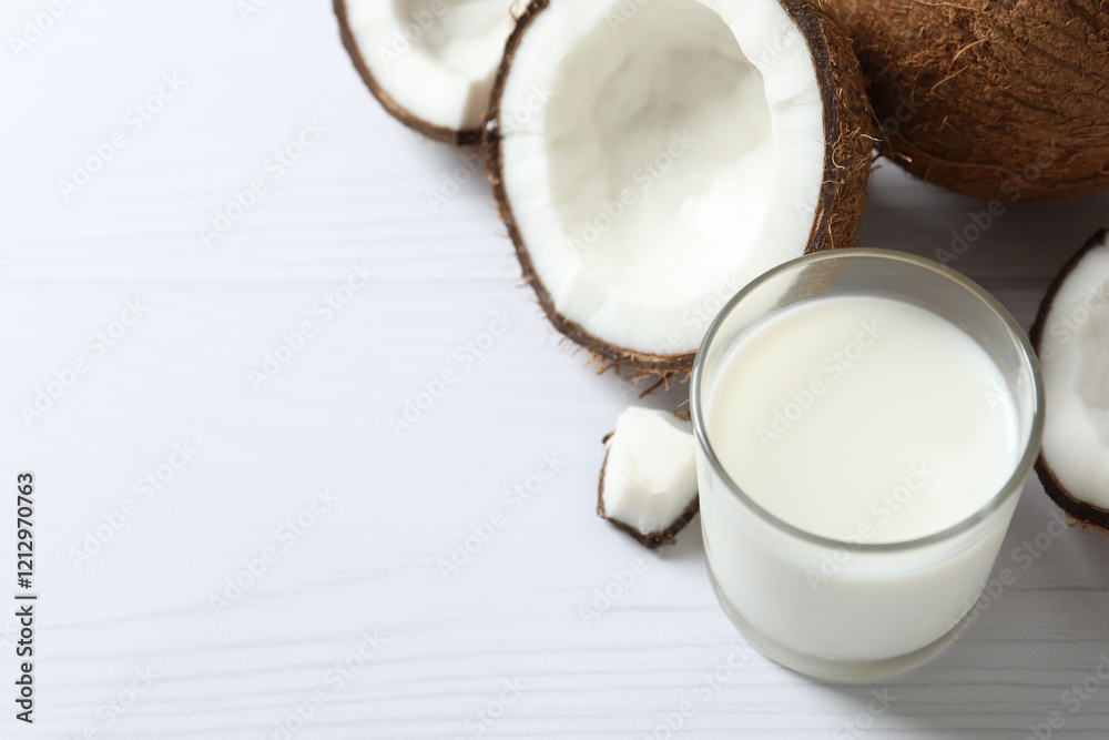 Glass of milk with coconuts on the table Glass of milk with coconuts on the table