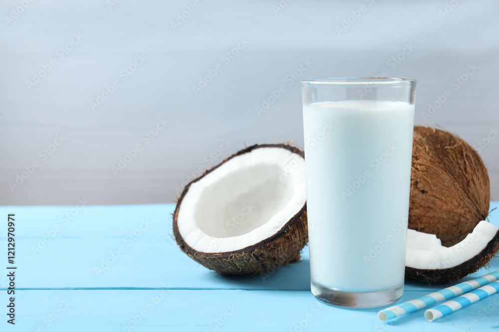 Glass of milk with coconuts on the table Glass of milk with coconuts on the table