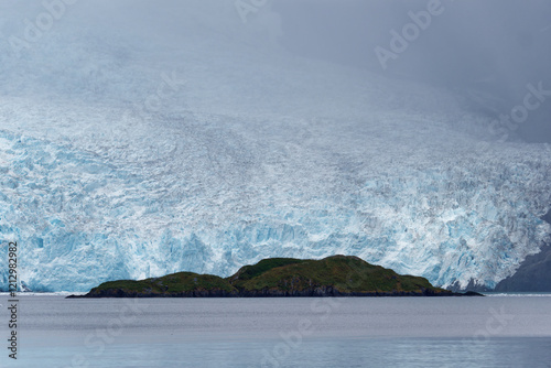 View from a tourist boat at stunning glacier in Alaska Kenai Fjords National Park, Alaska, USA photo