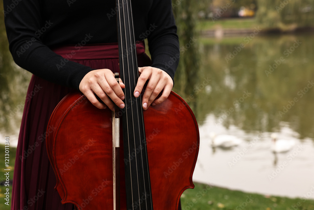 Woman with cello in park, closeup. Space for text Woman with cello in park, closeup. Space for text