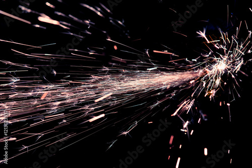 sparks of metal against dark background photo