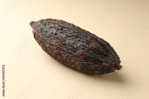 Wallpaper Mural Whole tropical cocoa pod on beige background Torontodigital.ca