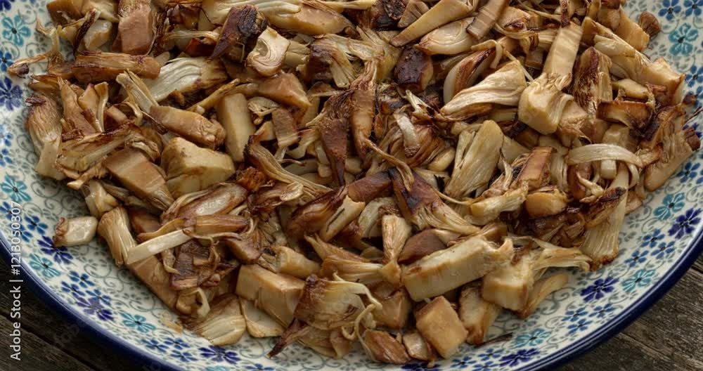 Stir-fried pulled jackfruit with soy sauce jackfruit on a plate. It's a great vegan substitute for shredded chicken. Table spin. Stir-fried pulled jackfruit with soy sauce jackfruit on a plate. It's a great vegan substitute for shredded chicken. Table spin.