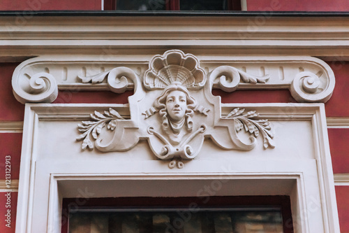 Photo of architecture, sculpture of a female goddess above the doors on a building in Odessa, Ukraine.